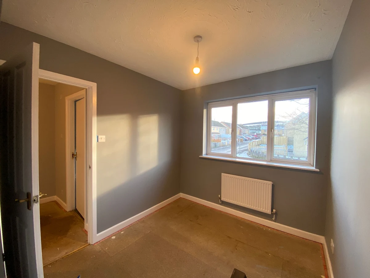 Bedroom painting with grey walls and white trim in Gowerton by Daffodil Decor