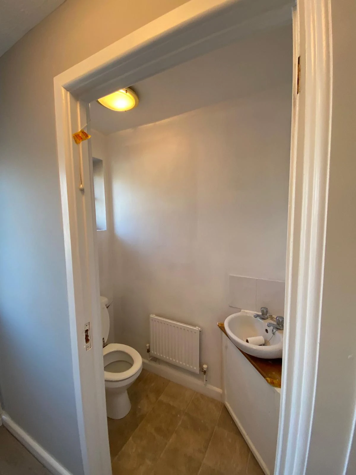 Downstairs WC freshly decorated in soft grey and brilliant white, Neath refurbishment by Daffodil Decor