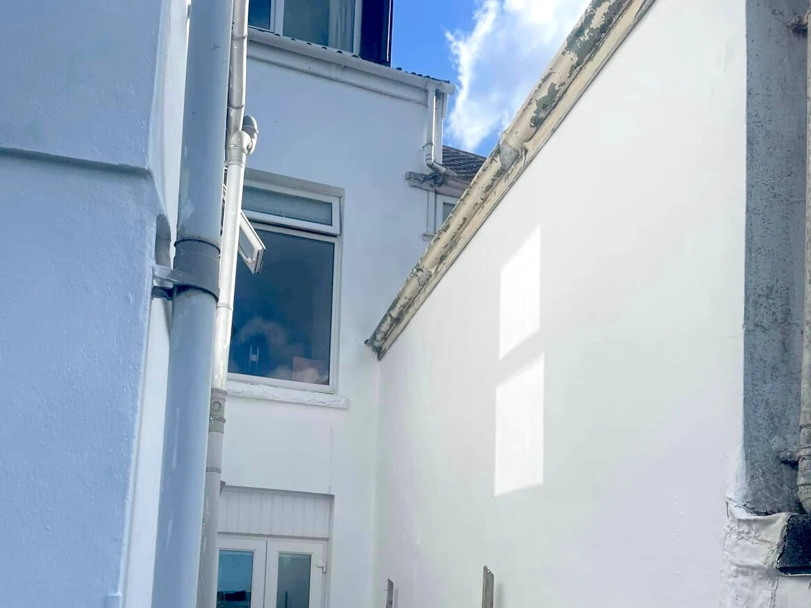 White painted house exterior in West Cross by Daffodil Decor, coastal house painting