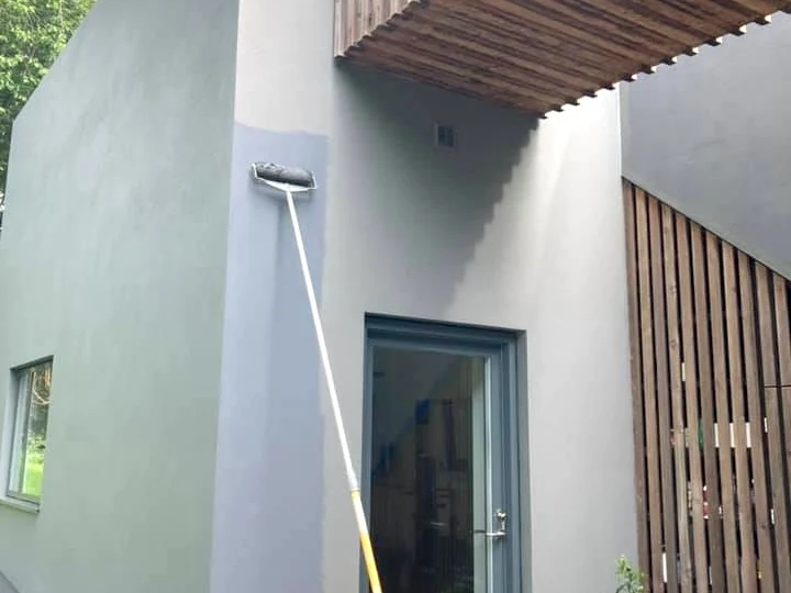 Garage door painting in Swansea by Daffodil Decor, white painted house with driveway