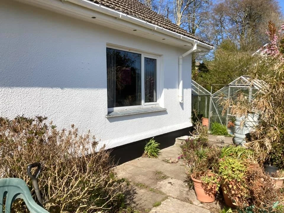 Painted pebbledash side elevation in West Cross by Daffodil Decor, coastal exterior painting