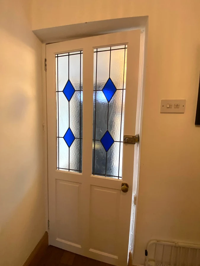 Hallway painting with white woodwork in Clydach by Daffodil Decor