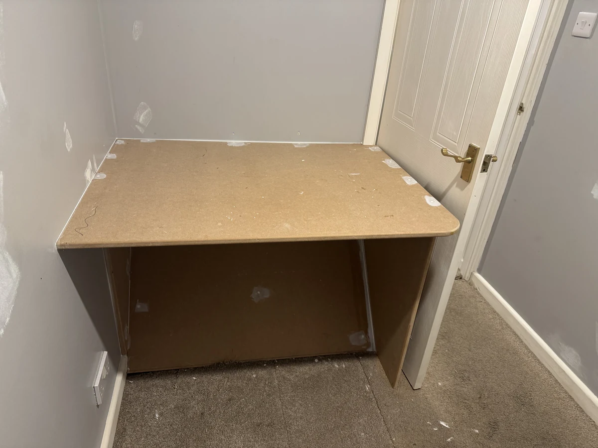 Built-in white desk made and finished on site in the small bedroom of a Neath refurbishment, by Daffodil Decor
