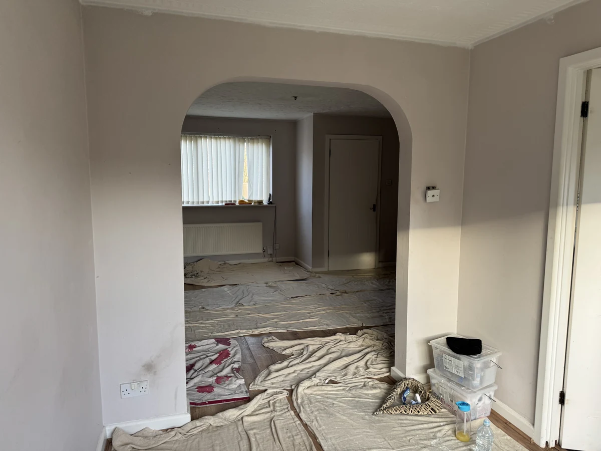 Interior painting through archway in Kingsbridge property