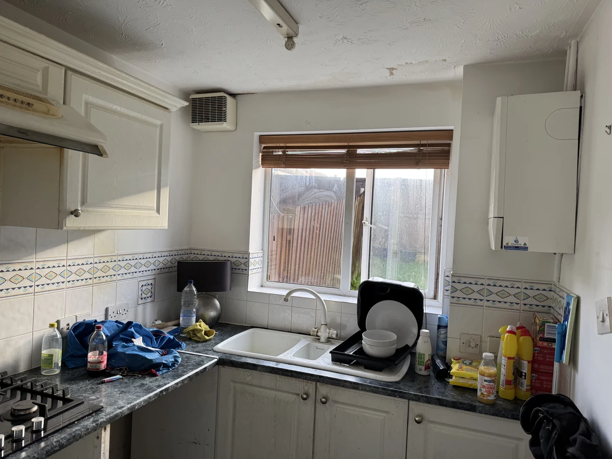 Kitchen painting full view with sink and boiler in Penderry by Daffodil Decor