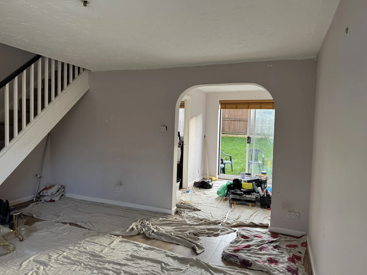Painters and decorators in Oystermouth by Daffodil Decor, living room with archway and garden doors