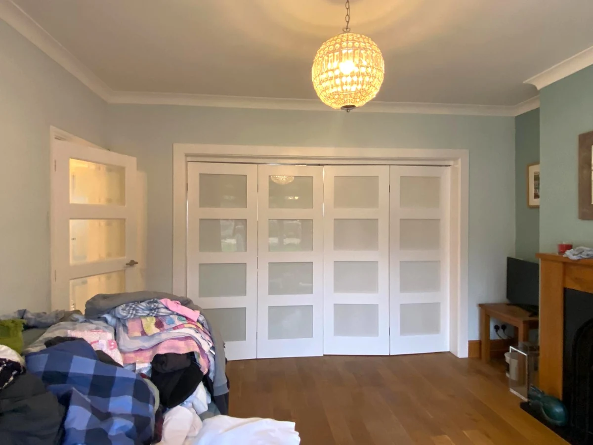 Living room with blue walls and white coving detail in Birchgrove, Daffodil Decor painters