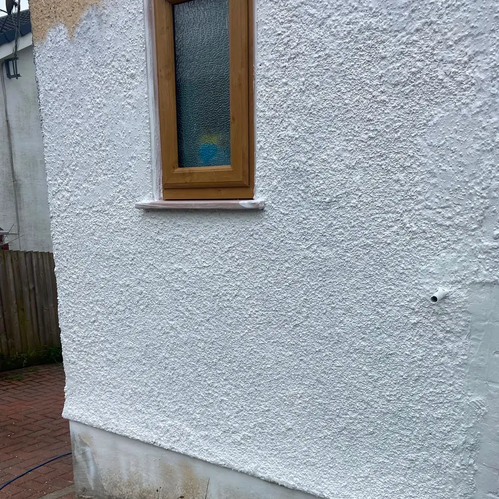 masonry-painting-in-progress-swansea-daffodil-decor First coat of masonry paint going over the old pebbledash, Swansea
