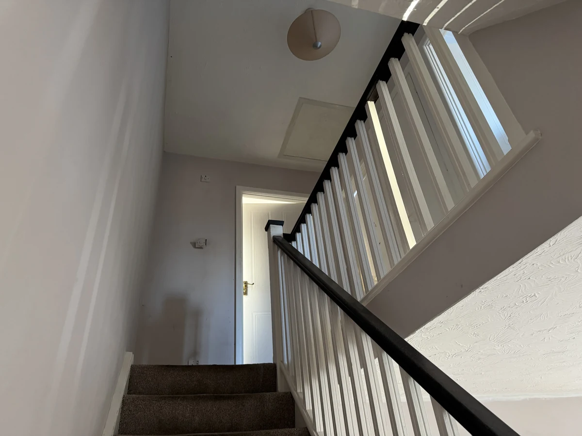 Staircase painting with white walls and ceiling in Landore property